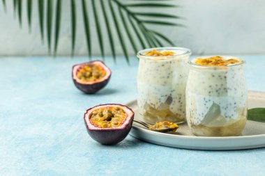dessert with yogurt and passion fruit in a light sunny background, Tropical drink for summer party.