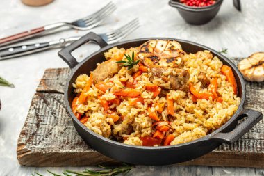 pilaf with beef, carrot in cast-iron pan. banner, menu, recipe place for text, top view,