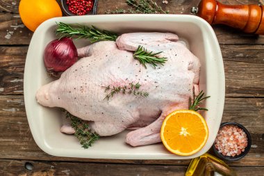 raw duck on a wooden background, Culinary cooking. banner, menu, recipe place for text, top view,