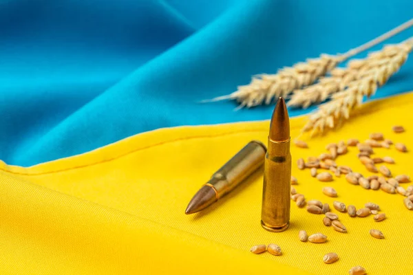flag of Ukraine with wheat spikelets. Stop the war. Concept of food supply crisis and global food scarcity. place for text, top view.