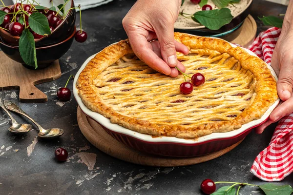 Delicious Homemade Cherry Pie, Flaky Crust, piece on a plate and the whole homemade cherry pie, place for text, top view,