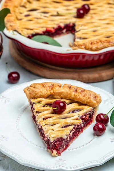 cherry pie, Flaky Crust, piece on a plate and the whole homemade cherry pie, place for text, top view,