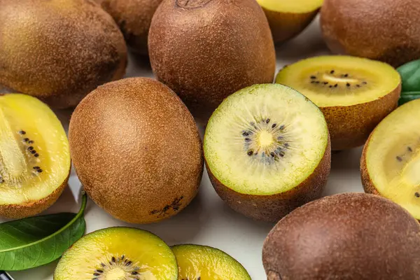 Organic Kiwi Fruit Cut Half Leaves Food Background Close — стоковое фото