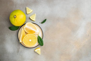 Fresh ripe bergamot orange fruits on a light background, Long banner format. top view,