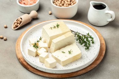 Tofu with bean on a light background, Culinary vegan and vegetarian eating, banner, menu, recipe place for text, top view,