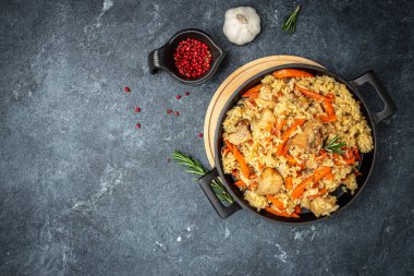 pilaf in a bowl, Uzbek dish. rice meat with vegetables. Restaurant menu, dieting, cookbook recipe top view.