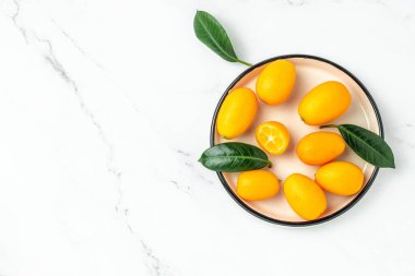 Raw Organic Orange Kumquats, banner, menu, recipe place for text, top view,