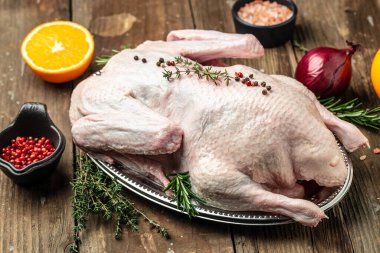 raw duck on a wooden background, Culinary cooking. banner, menu, recipe place for text, top view,