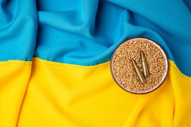 flag of Ukraine with wheat spikelets. Stop the war. Concept of food supply crisis and global food scarcity. place for text, top view.