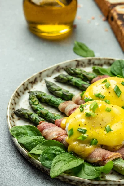 stock image asparagus with bacon, poached egg and hollandaise sause. Food recipe background. Close up