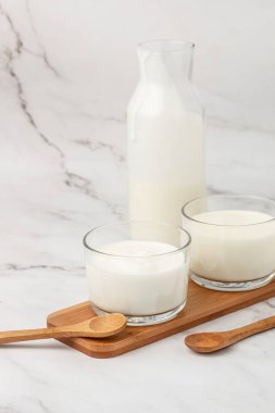 A bottle of milk and glass of yogurt, kefir, fermented milk, Probiotic cold fermented dairy drink. top view,