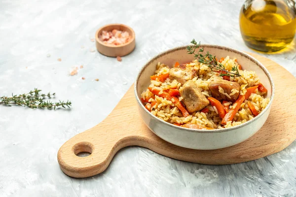 pilaf in a bowl, Uzbek dish. rice meat with vegetables. Restaurant menu, dieting, cookbook recipe top view.