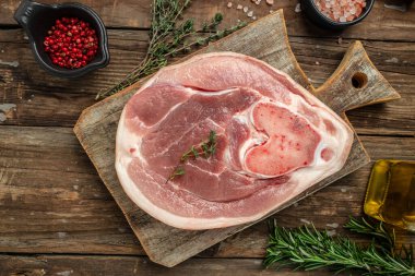 pork leg on a wooden background, banner, menu, recipe place for text, top view,