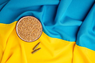 flag of Ukraine with wheat spikelets. Stop the war. Concept of food supply crisis and global food scarcity. place for text, top view.