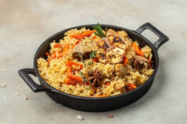 plate of pilaf. traditional Uzbek dish. rice with vegetables. banner, menu, recipe place for text, top view.