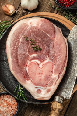 pork leg on a wooden background, banner, menu, recipe place for text, top view,