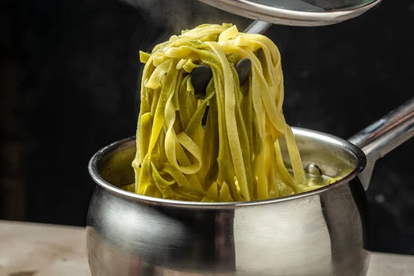 stock image Closeup of boiling spaghetti pasta. put salt and olive oil inside water in the pot.