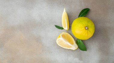 Fresh ripe bergamot orange fruits on a light background, Long banner format. top view.