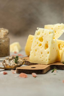 cheese with holes and truffle paste. Food recipe background. Close up.