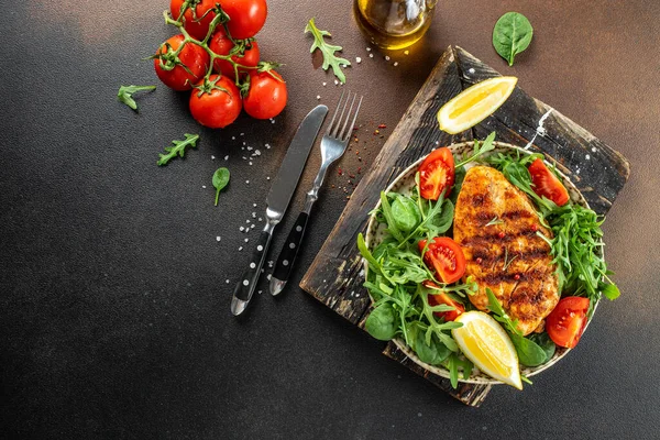 stock image Grilled chicken breast with tomatoes and herbs, Healthy, clean eating. place for text, top view,