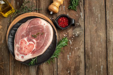 pork leg on a wooden background, banner, menu, recipe place for text, top view,