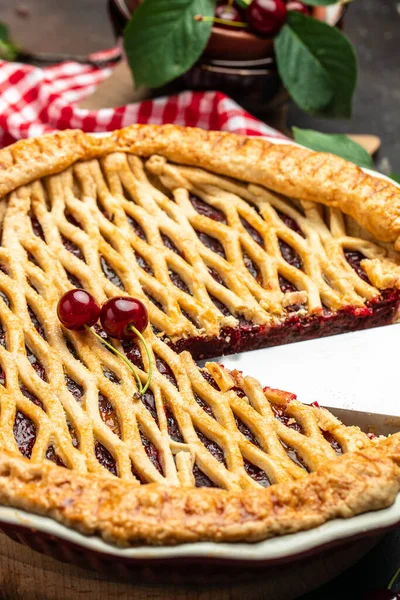 cherry pie, Flaky Crust, piece on a plate and the whole homemade cherry pie, place for text, top view,