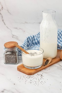 homemade yogurt, kefir, fermented milk on a light background. Healthy, clean eating. Vegan or gluten free diet.
