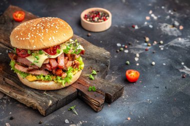 home made tasty burger with grilled beef meat fast food and junk food concept.