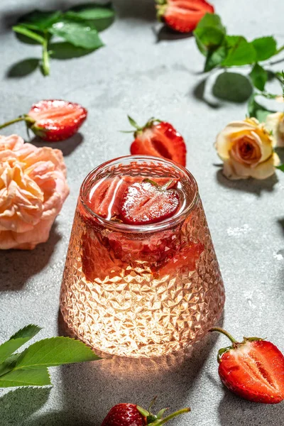 strawberry wine and roses. vertical image. top view. place for text.