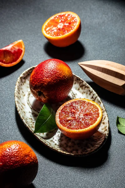 red orange. Ripe blood orange slice on plate. vertical image. top view. place for text.