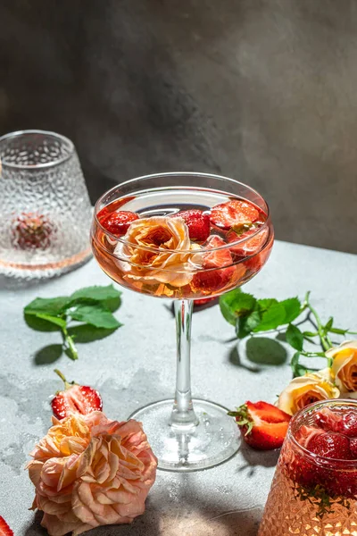 alcoholic cocktail with wine, strawberry in glasses, vertical image. top view. place for text,