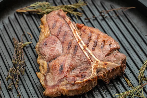 Beef steaks on the grill with flames. banner, menu, recipe place for text, top view.