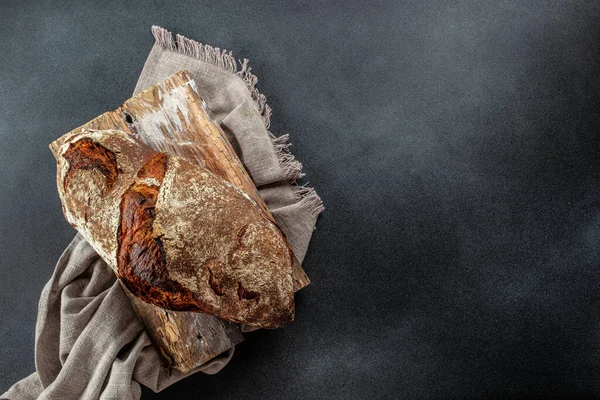 bread on a dark background. banner, menu, recipe place for text, top view.