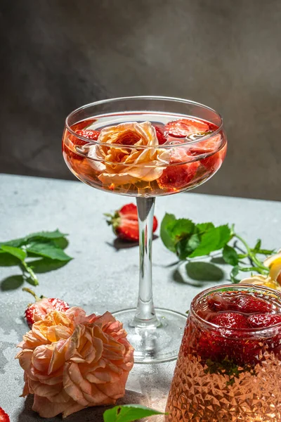 glasses of rose wine with strawberries, Summer drink, wine shop, wine concept, vertical image. top view. place for text,