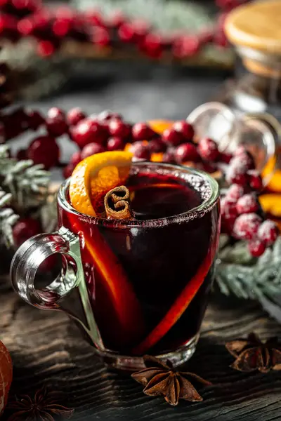 mulled wine, hot warming drink with spices and oranges, Traditional hot drink at Christmas.