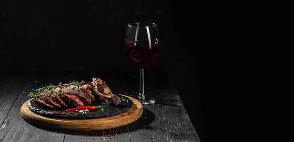 wine glasses with steak. Long banner format. copy space for text.