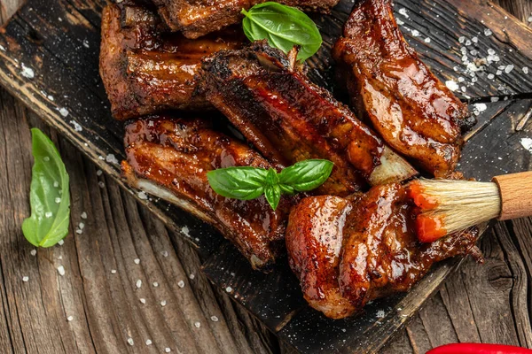 Grilled and smoked ribs with sauce. Healthy dinner or lunch.
