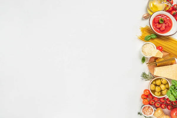 pasta and ingredients for cooking on white background, italian cuisine concept.