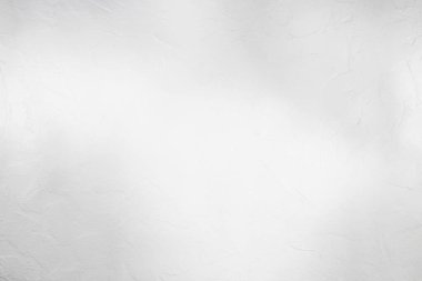 Temiz minimalist arkaplan için ince gölgeli parlak beyaz desenli alçı duvar.