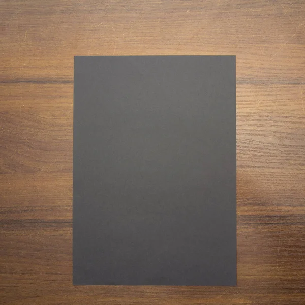 Λευκό Φύλλο Χαρτιού Ξύλινο Φόντο — Φωτογραφία Αρχείου