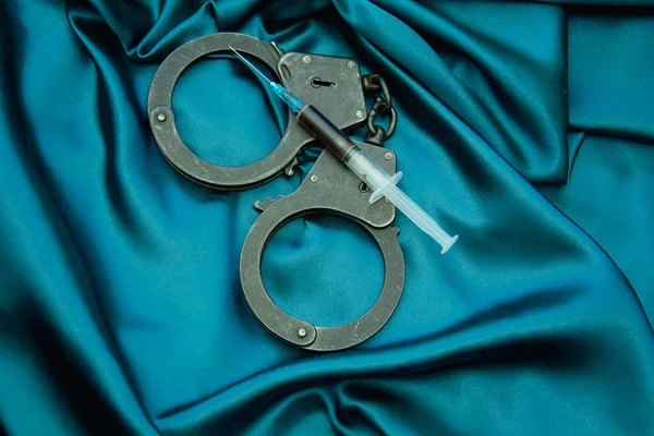 handcuffs and accessories on a black background