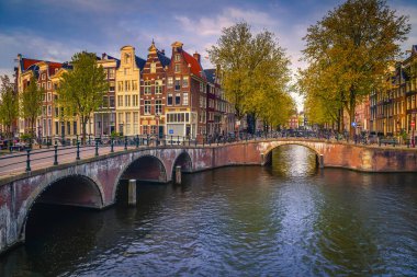 One of the most beautiful and visited old bridge over the water canals in Amsterdam, Netherlands, Europe