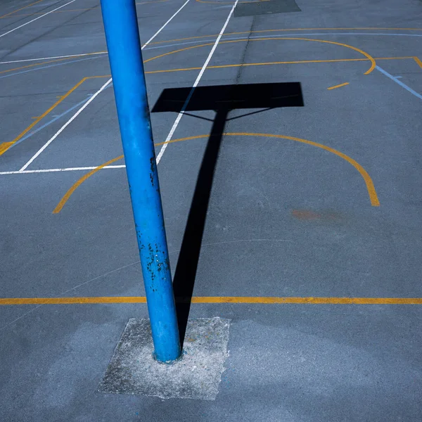 street basketballl hoop shadow on the sports court