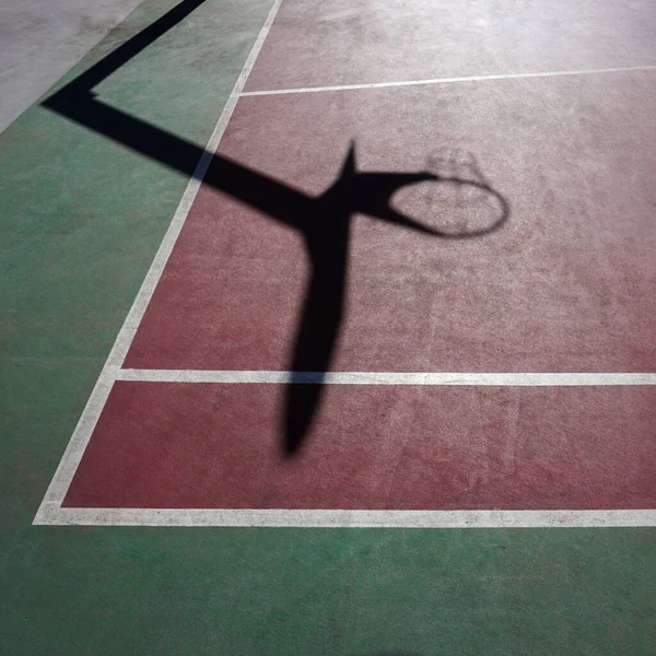 street basket shadow on the sports court