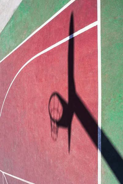 street basket shadow on the sports court
