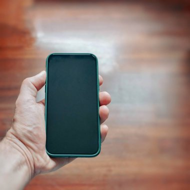 hand holding a smart phone, phone addicted 