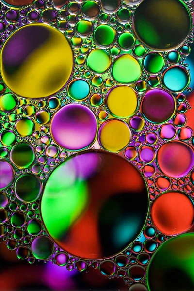 stock image multi colored oil circles on the water, colorful background 