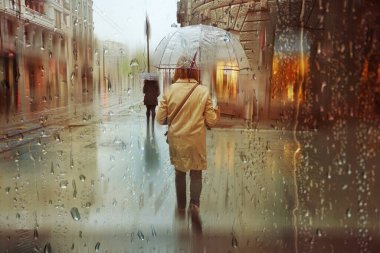 people with an umbrella in rainy days in winter season, bilbao, basque country, spain 