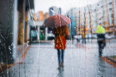 people with an umbrella in rainy days in winter season, bilbao, basque country, spain 