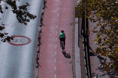 cyclist on the street, bicycle mode of transportation in Bilbao city, spain 